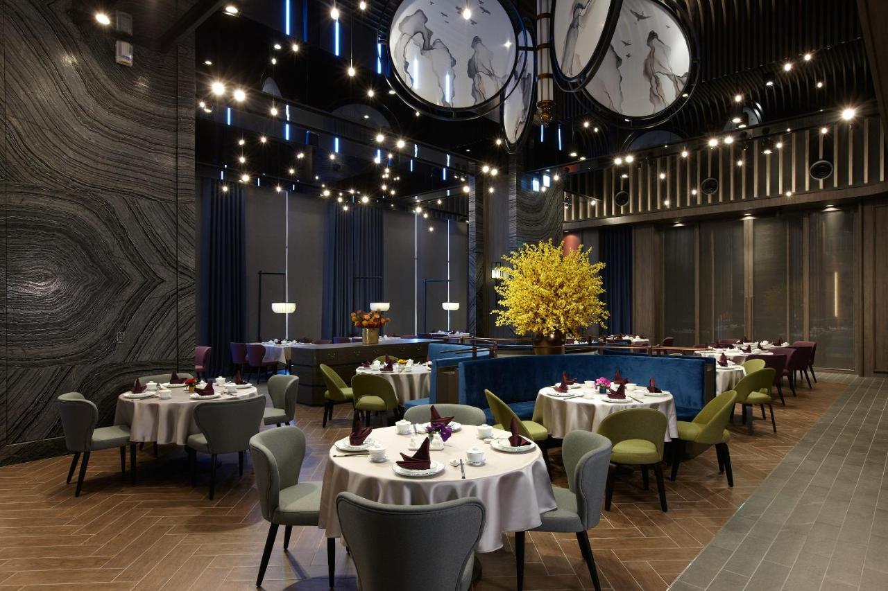 Cozzi Blu Hotel Csungli Kültér fotó Interior of the restaurant